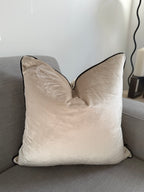 Cream velvet cushion cover with black piping